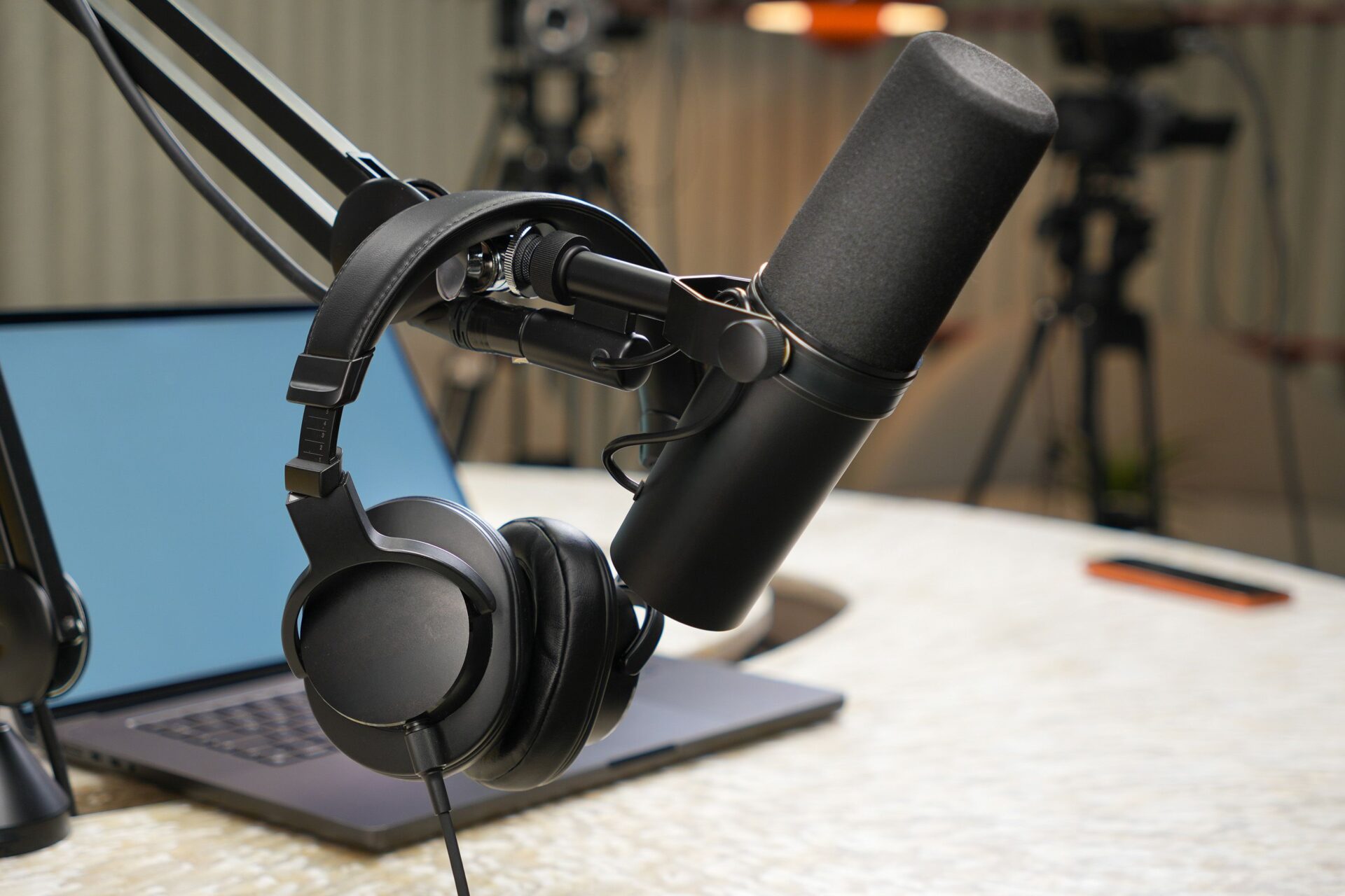 Established podcast recording an episode in a professional studio